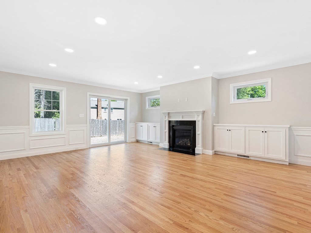 125 Thornton Road Waltham, MA 02453 - Photo 17 of 42 a view of an empty room with wooden floor and a window