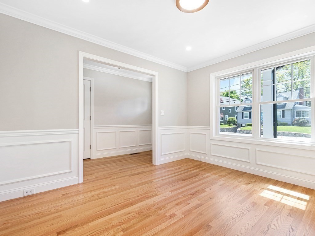 125 Thornton Road Waltham, MA 02453 - Photo 19 of 42 a view of an empty room with wooden floor and a window