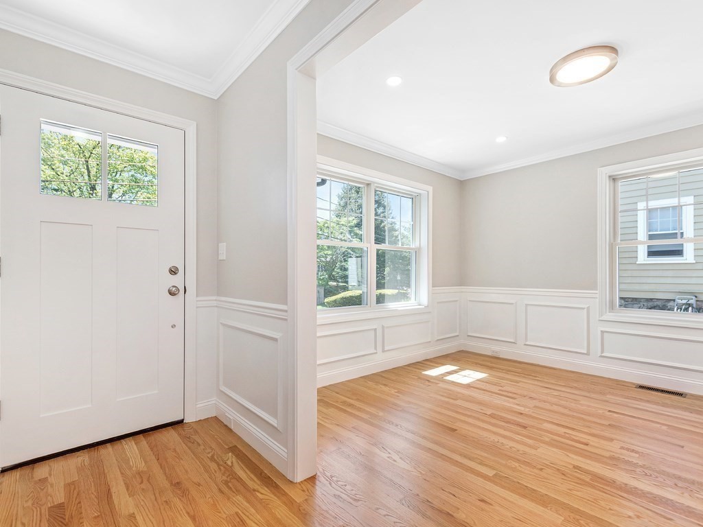 125 Thornton Road Waltham, MA 02453 - Photo 21 of 42 an empty room with wooden floor and windows