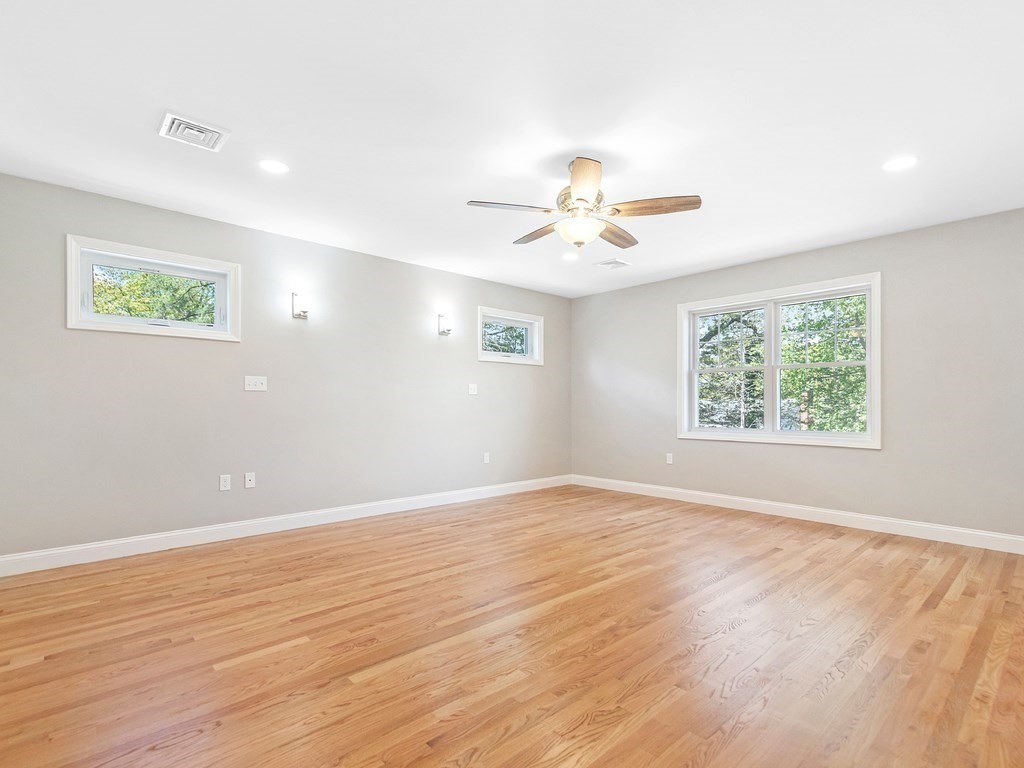 125 Thornton Road Waltham, MA 02453 - Photo 25 of 42 an empty room with wooden floor and window