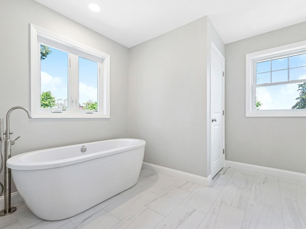 125 Thornton Road Waltham, MA 02453 - Photo 30 of 42 a white tub sitting next to a window