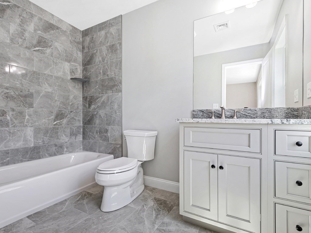 125 Thornton Road Waltham, MA 02453 - Photo 34 of 42 a bathroom with a sink a toilet and a bathtub