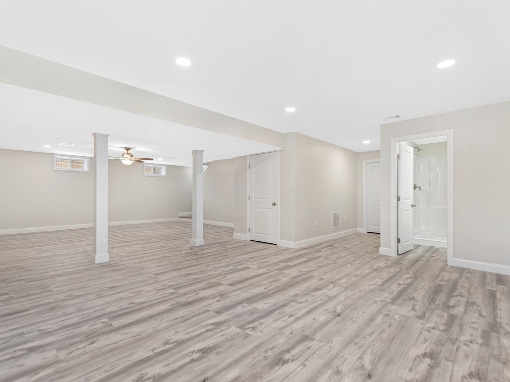 125 Thornton Road Waltham, MA 02453 - Photo 36 of 42 a view of an empty room with wooden floor