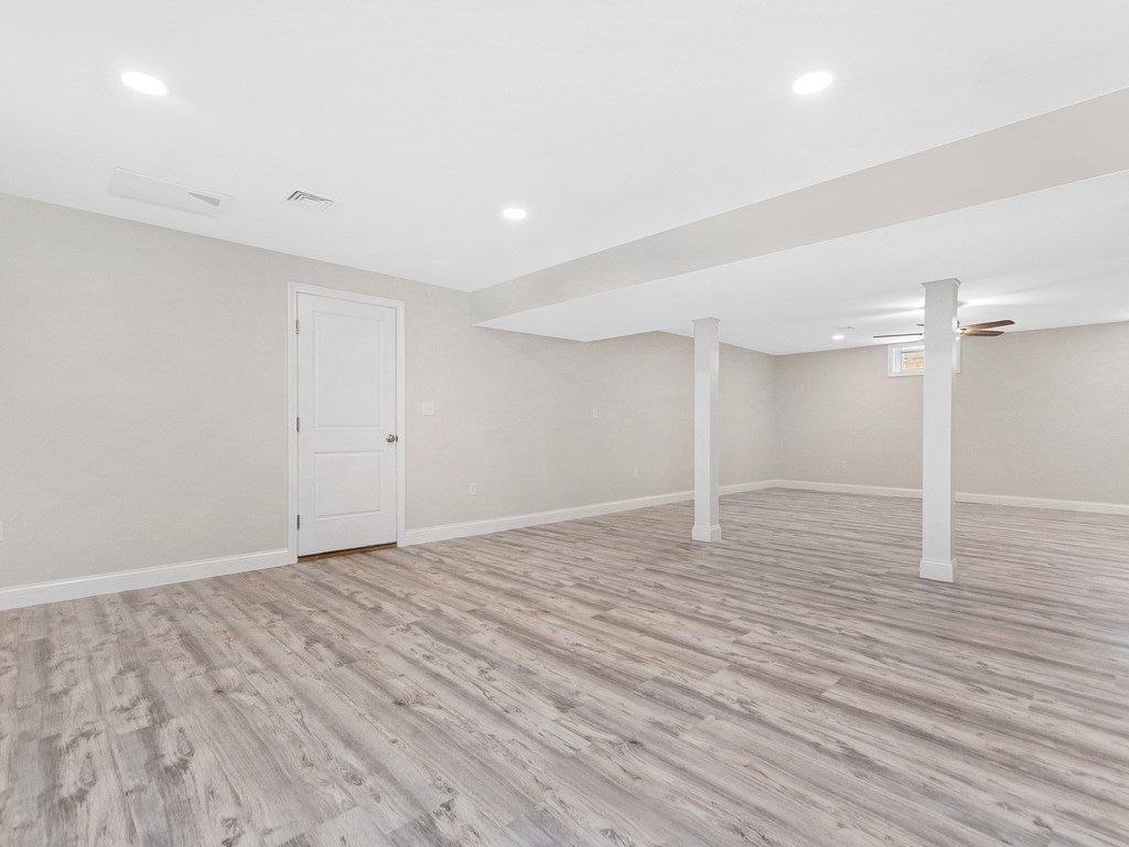 125 Thornton Road Waltham, MA 02453 - Photo 37 of 42 a view of empty room with wooden floor