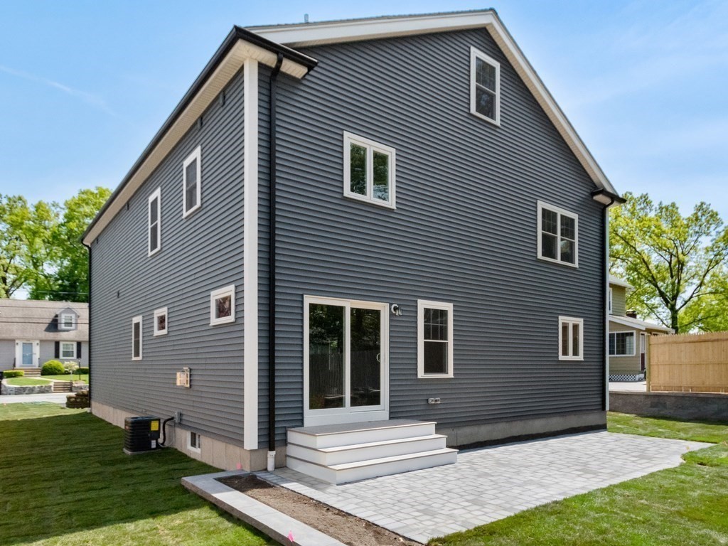 125 Thornton Road Waltham, MA 02453 - Photo 39 of 42 a front view of a house with garden
