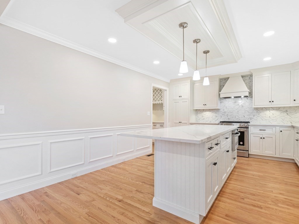 125 Thornton Road Waltham, MA 02453 - Photo 5 of 42 a large kitchen with granite countertop a large counter top and sink