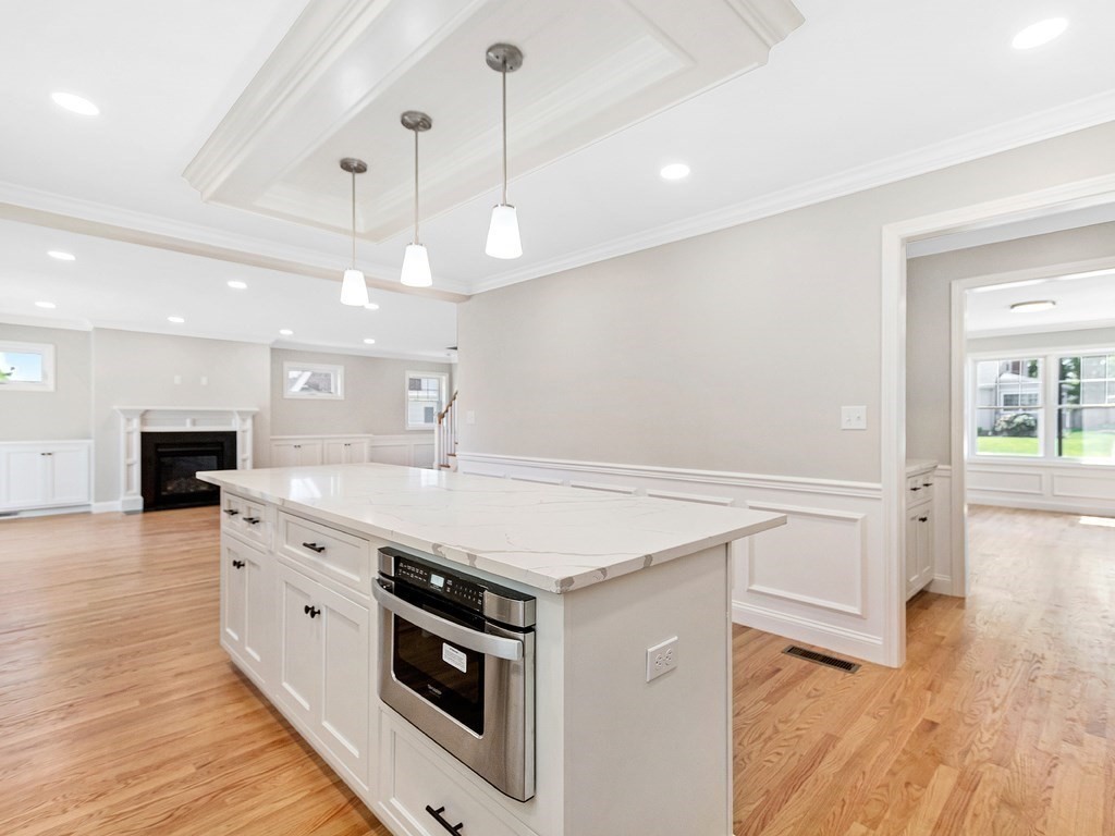 125 Thornton Road Waltham, MA 02453 - Photo 6 of 42 a kitchen with a stove and a wooden floor