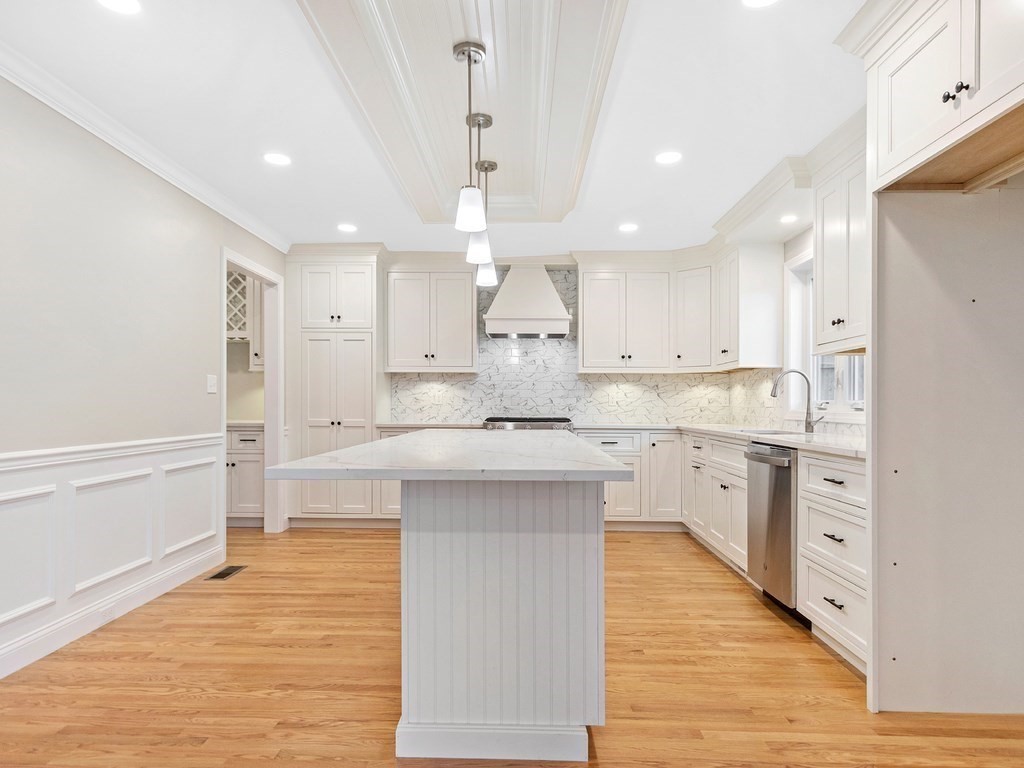 125 Thornton Road Waltham, MA 02453 - Photo 7 of 42 a large kitchen with cabinets wooden floor and stainless steel appliances