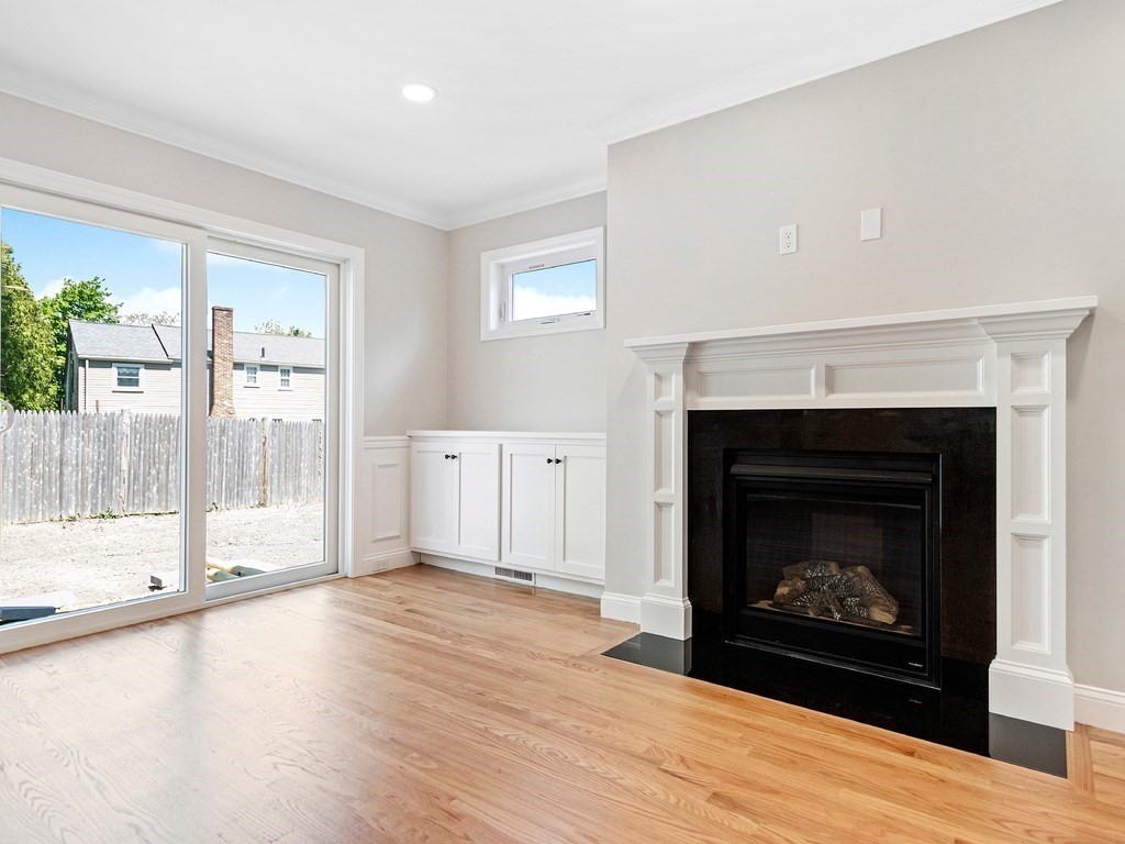 125 Thornton Road Waltham, MA 02453 - Photo 10 of 42 a living room with a fireplace