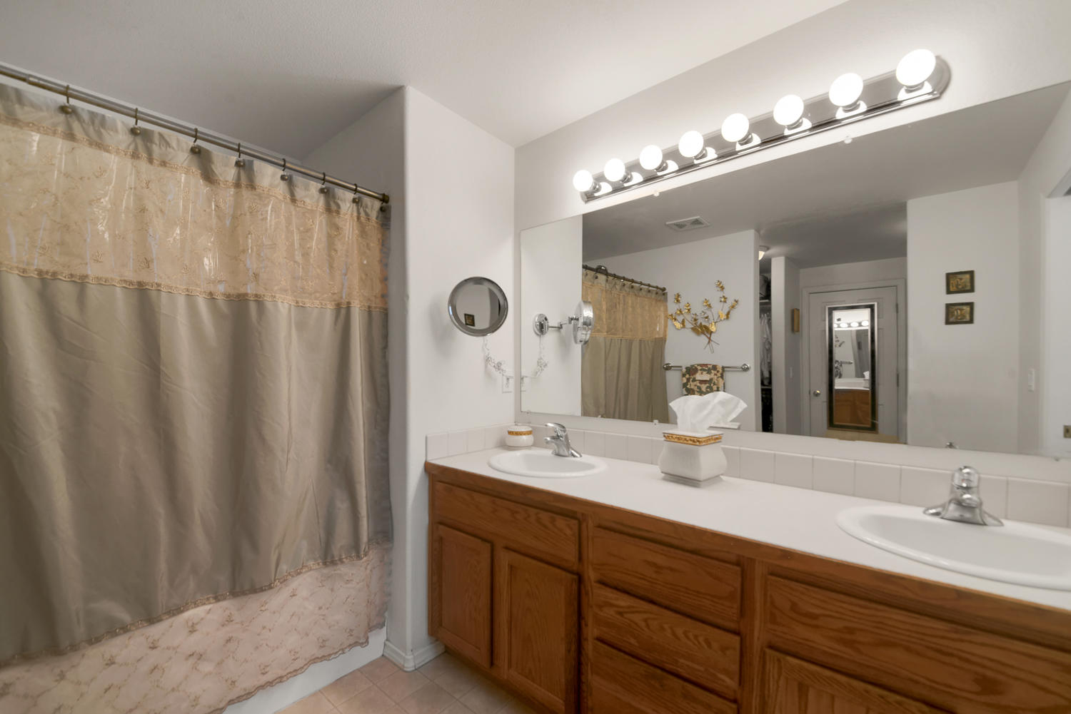52311 Ammon Road La Pine, OR 97739 - Photo 26 of 39 a bathroom with a double vanity sink and a mirror