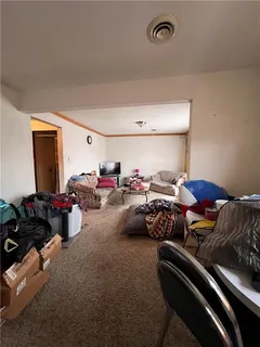 a room with furniture and a book shelf