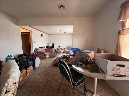 a view of a livingroom with furniture and toys