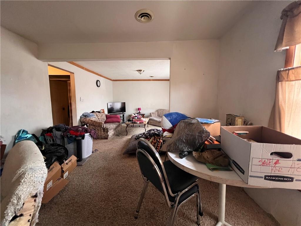 423 Spring Avenue Ellwood City, PA 16117 - Photo 16 of 20 a living room with furniture and a window