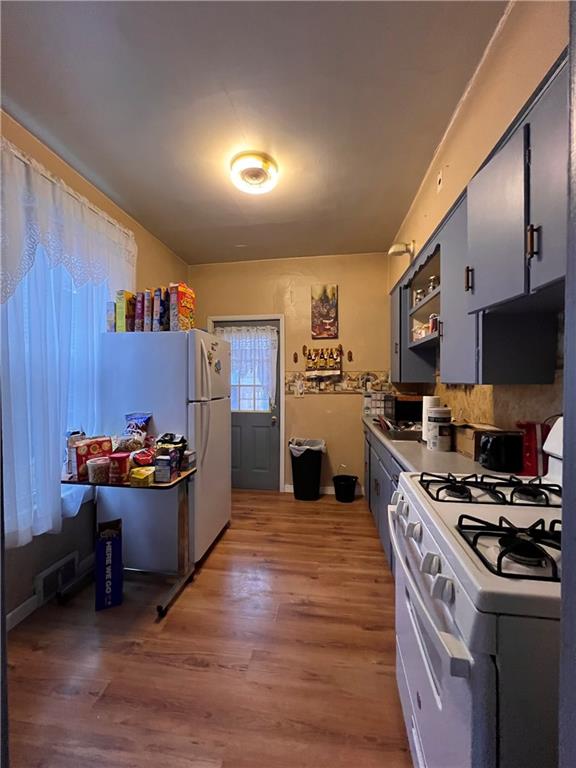 423 Spring Avenue Ellwood City, PA 16117 - Photo 7 of 20 a kitchen with a stove and a refrigerator