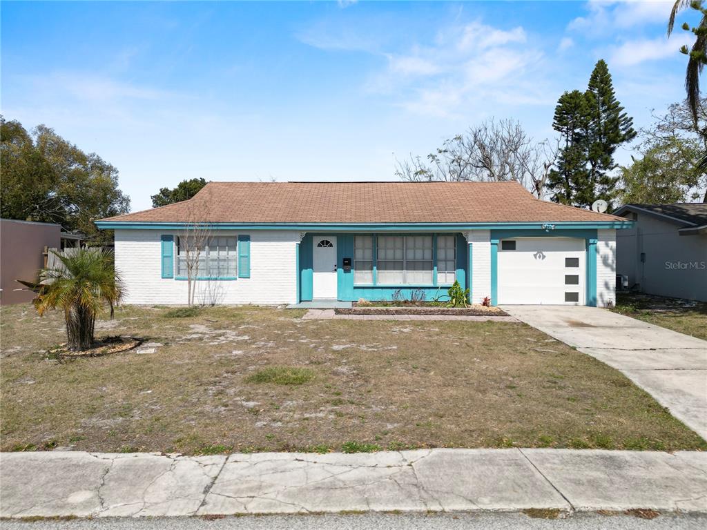 4037 Grayton Drive New Port Richey, FL 34652 - Photo 1 of 1 front view of a house with a outdoor space