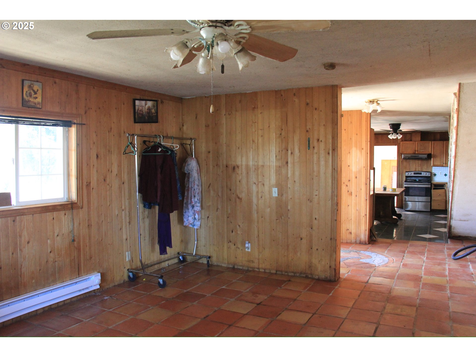 12051 South Riggs Damm Road Canby, OR 97013 - Photo 12 of 27 a living room with furniture and a walk in closet