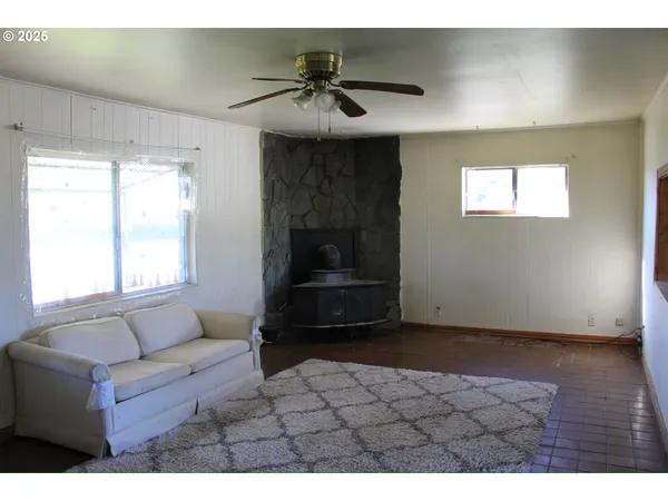 a kitchen with stainless steel appliances granite countertop a refrigerator a stove and a sink