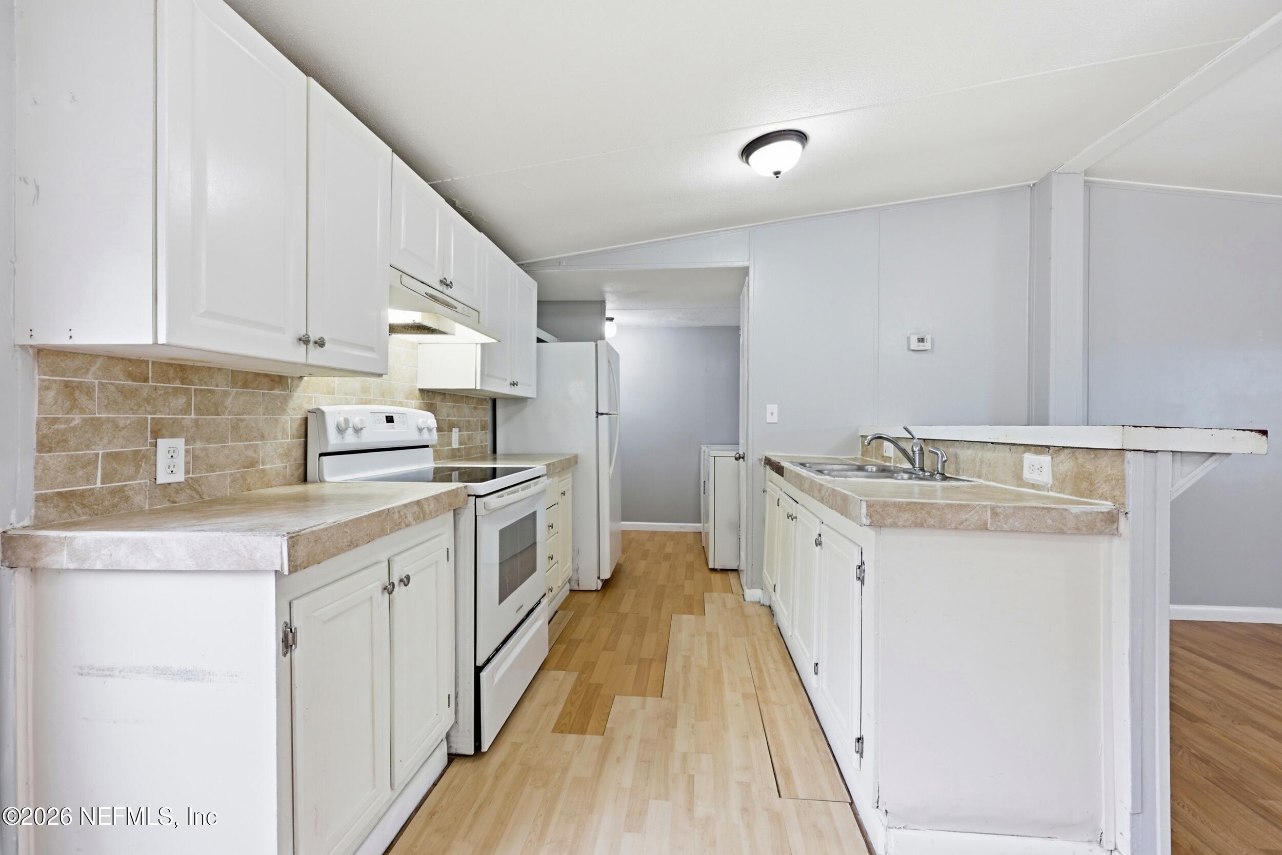 111 Hurst Street St. Augustine, FL 32084 - Photo 10 of 32 Kitchen and laundry