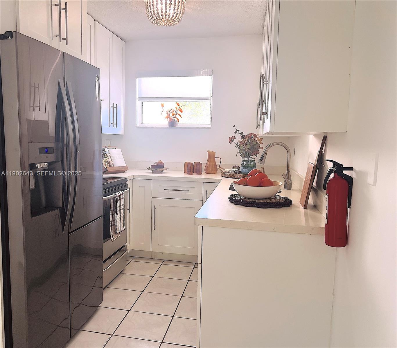 2496 Southwest 17th Avenue, Unit 5308 Miami, FL 33145 - Photo 1 of 19 a kitchen with a sink appliances and cabinets