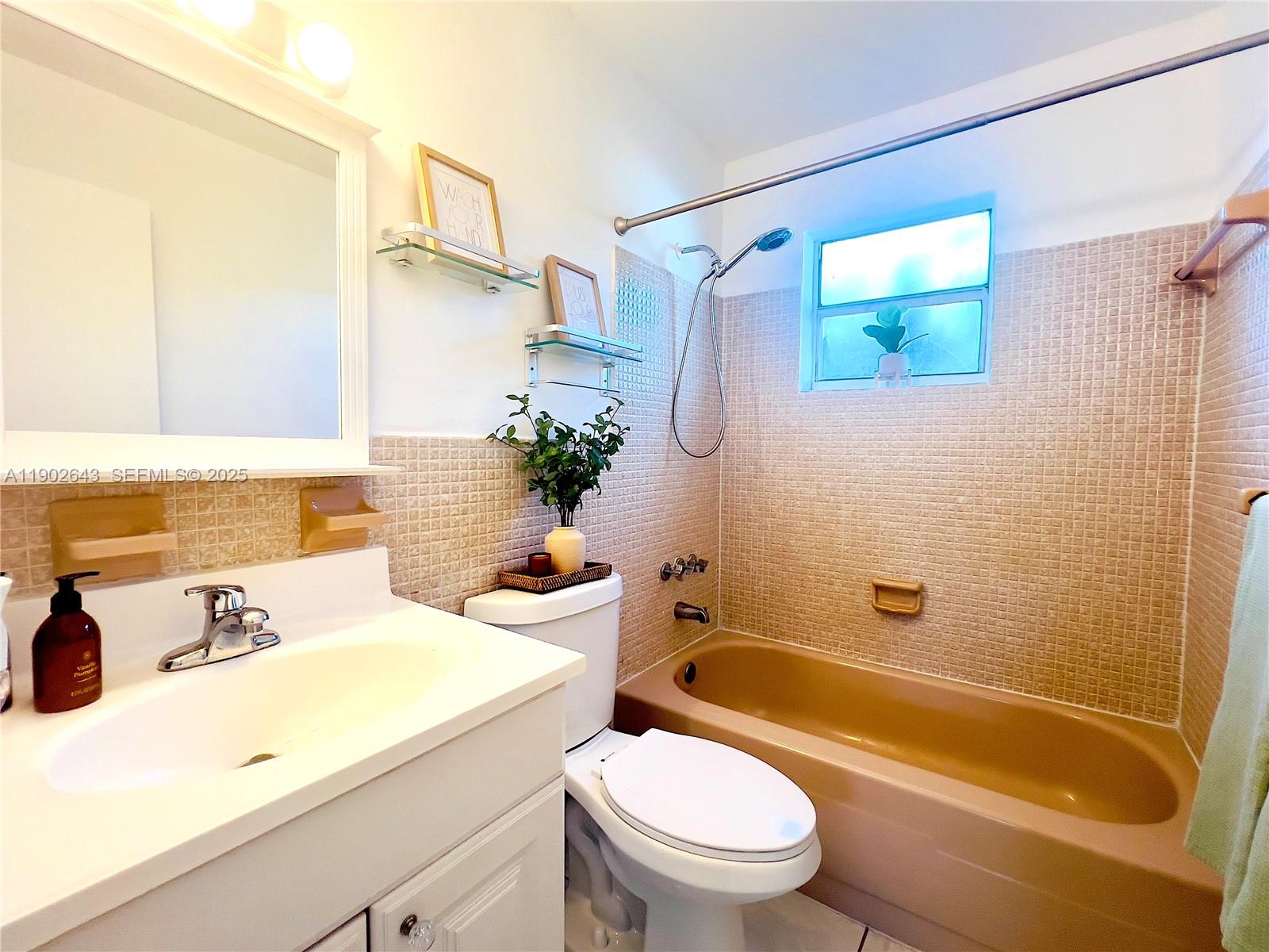 2496 Southwest 17th Avenue, Unit 5308 Miami, FL 33145 - Photo 12 of 19 a bathroom with a sink a toilet and shower