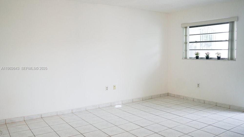 2496 Southwest 17th Avenue, Unit 5308 Miami, FL 33145 - Photo 8 of 19 an empty room with a window