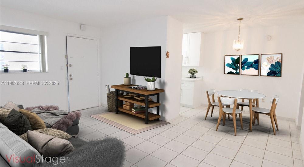 2496 Southwest 17th Avenue, Unit 5308 Miami, FL 33145 - Photo 9 of 19 a living room with furniture and a flat screen tv