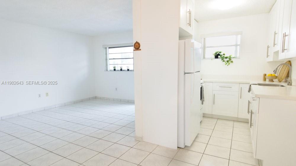 2496 Southwest 17th Avenue, Unit 5308 Miami, FL 33145 - Photo 10 of 19 a view of a kitchen with white cabinets