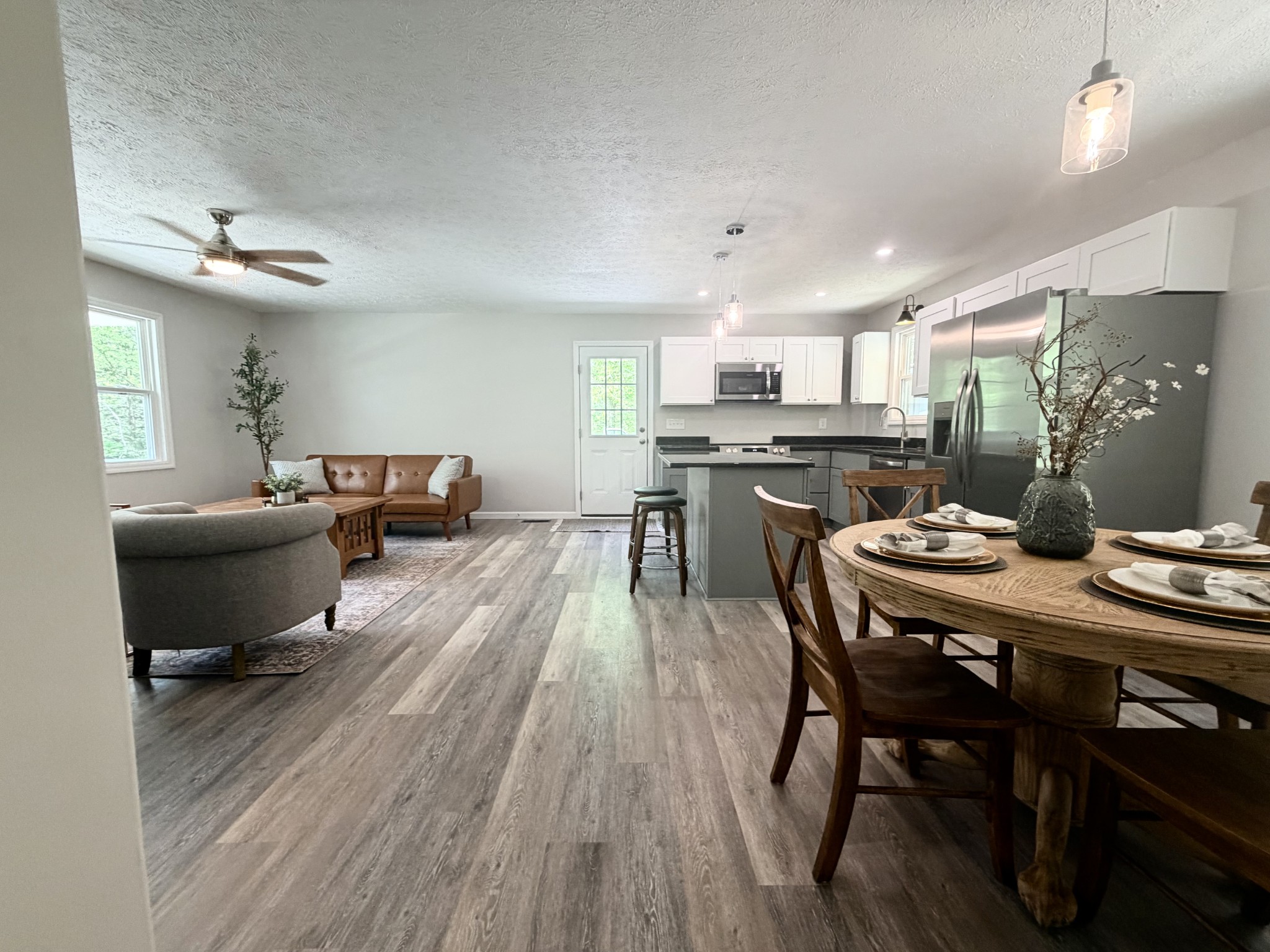 5075 Logan Road Cunningham, TN 37052 - Photo 12 of 22 a view of a dining room with furniture window and wooden floor