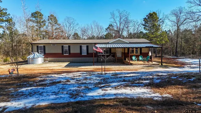 a swimming pool view with a seating space