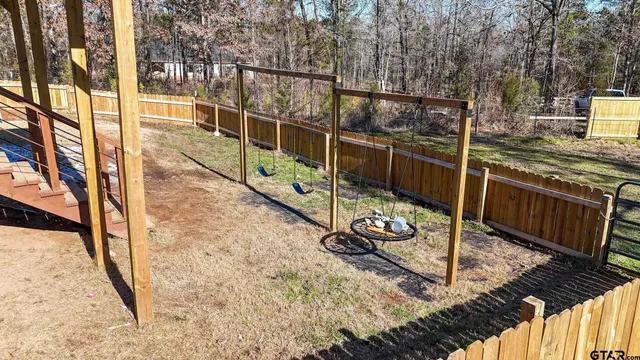 a view of a balcony with yard