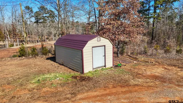 a view of a house with a tree