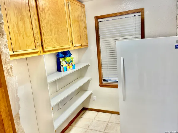 a view of walk in closet with window
