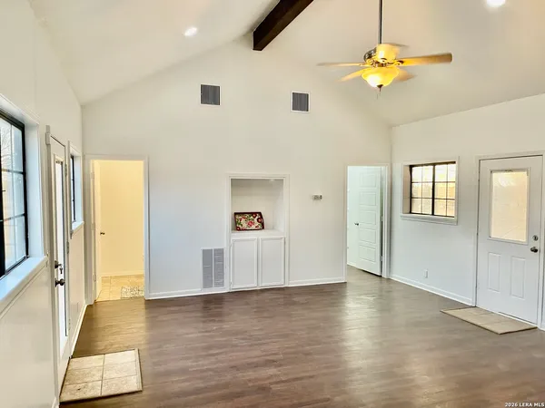 a view of a livingroom with wooden floor