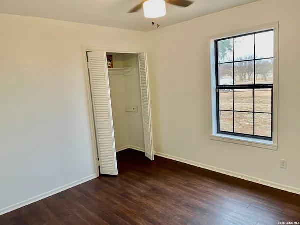 a view of a small space with wooden floor
