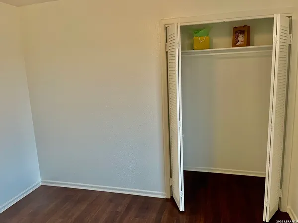 a bathroom with a toilet and a shower curtain