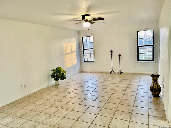 a view of an empty room and window