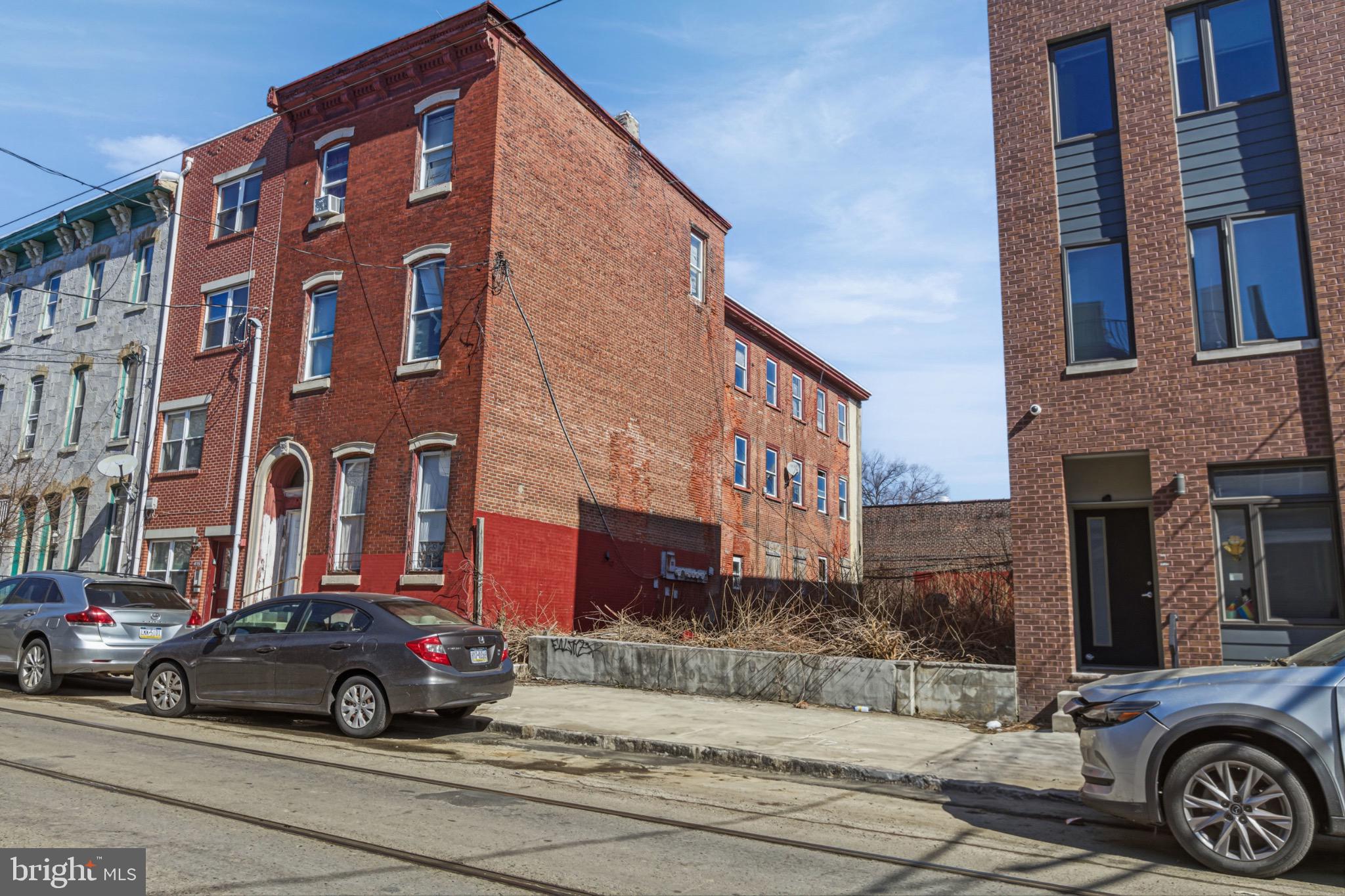 a view of a car parked in front of a building