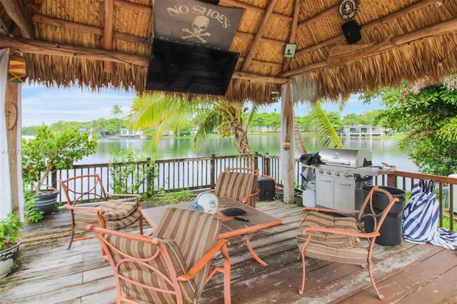 a view of a chairs and table in the patio