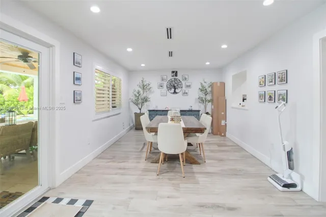 a view of a dining room with furniture window and outside view