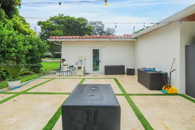 a view of a swimming pool with a patio