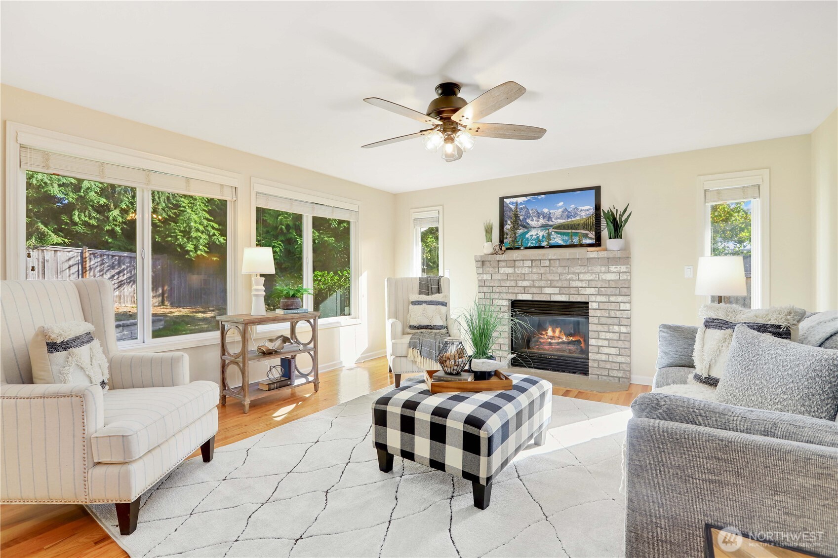 6405 154th Street Southeast Snohomish, WA 98296 - Photo 14 of 39 a living room with furniture and a fireplace