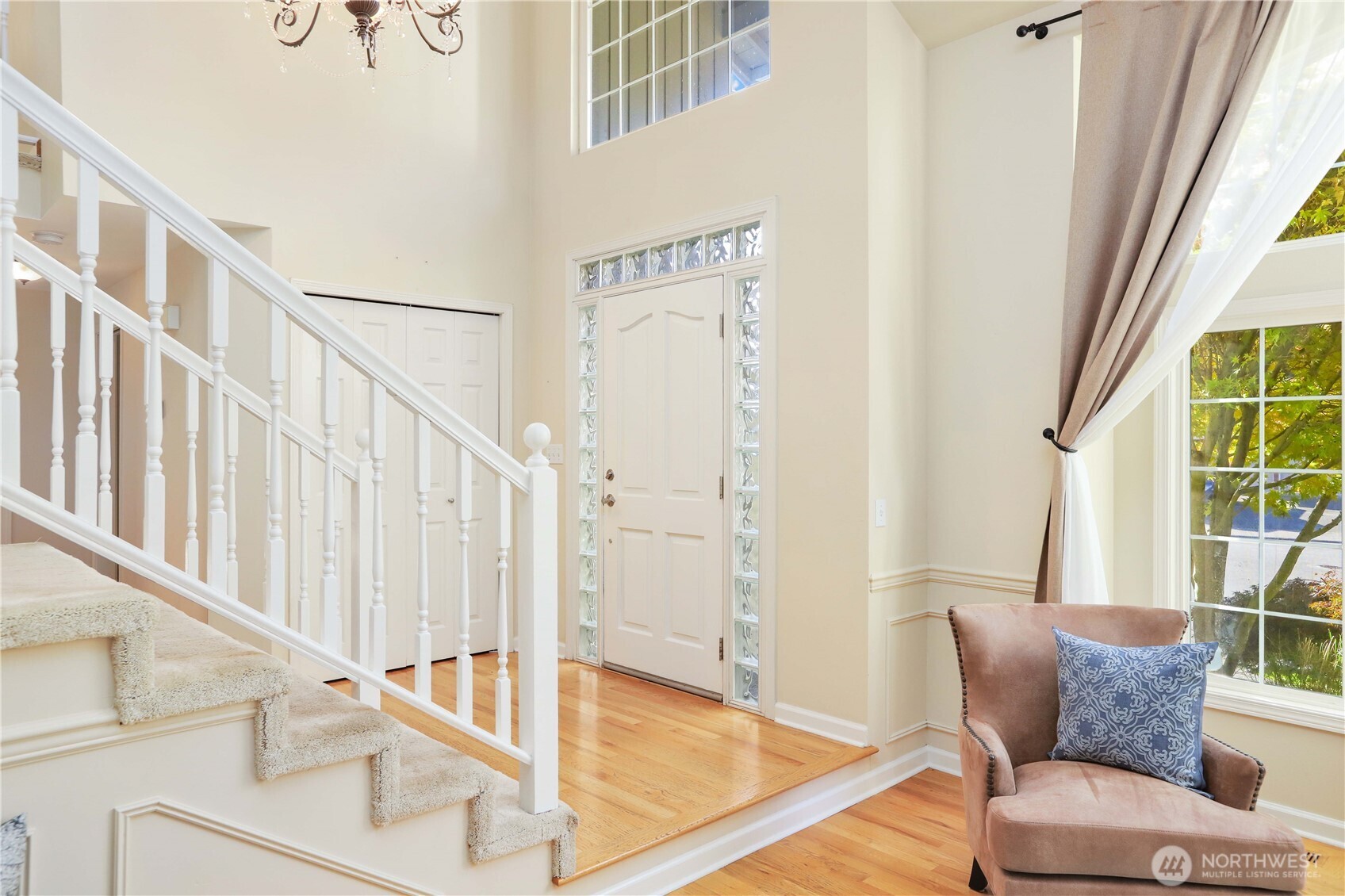 6405 154th Street Southeast Snohomish, WA 98296 - Photo 2 of 39 a living room with furniture and a floor to ceiling window