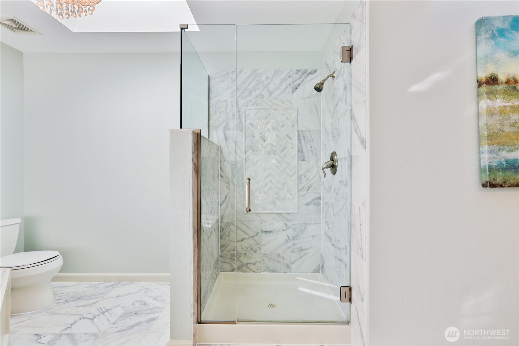 6405 154th Street Southeast Snohomish, WA 98296 - Photo 24 of 39 a bathroom with a glass shower door