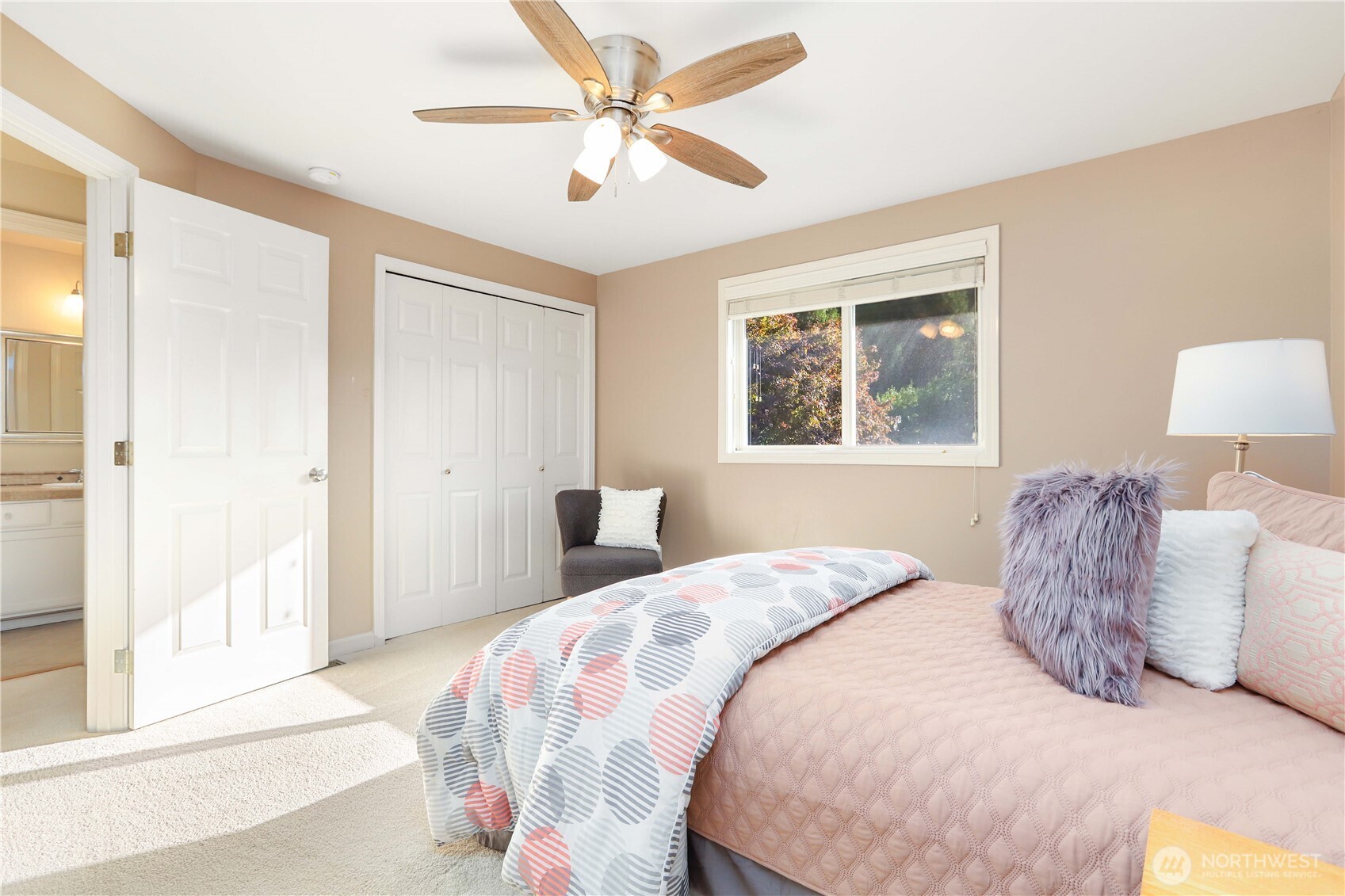 6405 154th Street Southeast Snohomish, WA 98296 - Photo 30 of 39 a bedroom with a large bed and a window