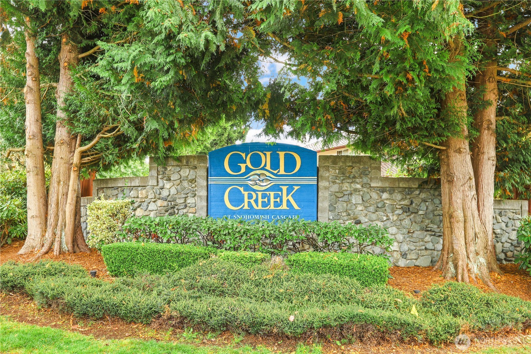 6405 154th Street Southeast Snohomish, WA 98296 - Photo 38 of 39 a sign that is sitting on a brick wall