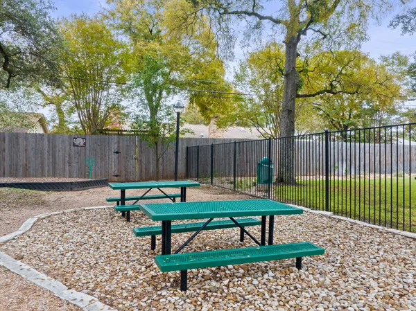 a view of a bench in the backyard