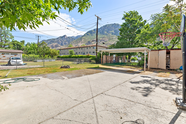 372 800 East Provo, UT 84606 - Photo 28 of 29 Concrete patio and yard area featuring a detached carport structure