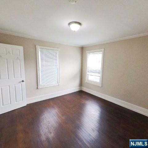 167 James Street Hackensack, NJ 07601 - Photo 20 of 30 a view of an empty room with wooden floor and a window