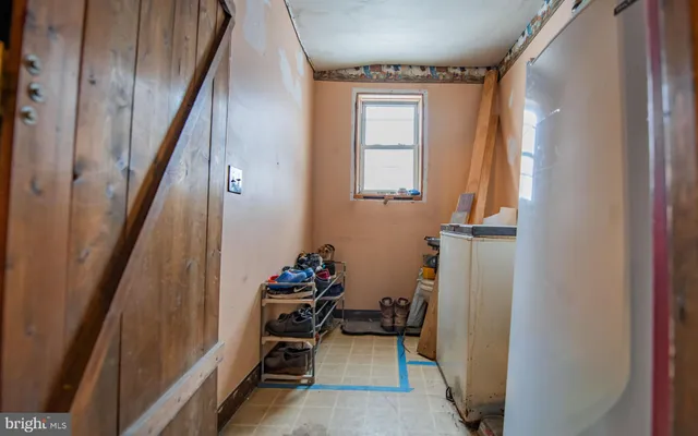 a view of a livingroom with furniture and stairs