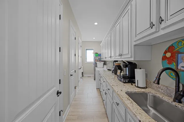 a kitchen with stainless steel appliances a sink and cabinets